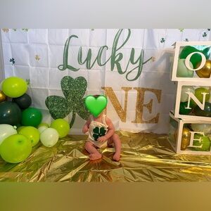 Lucky one first birthday cake smash outfit and decor